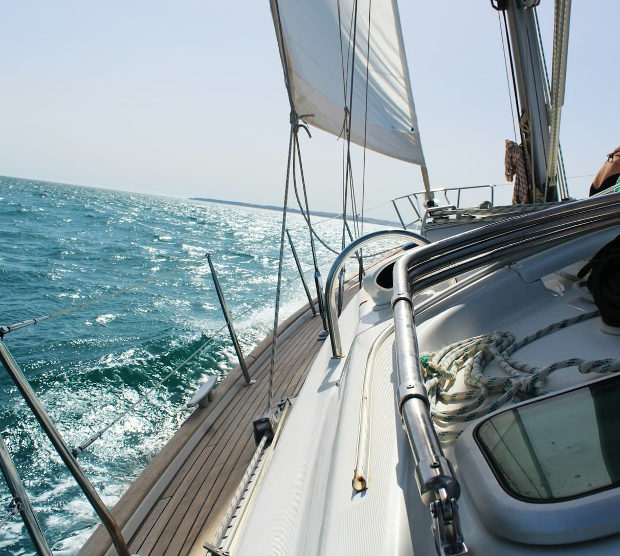 Sailboat deck cutting through Mediterranean Sea near Barcelona