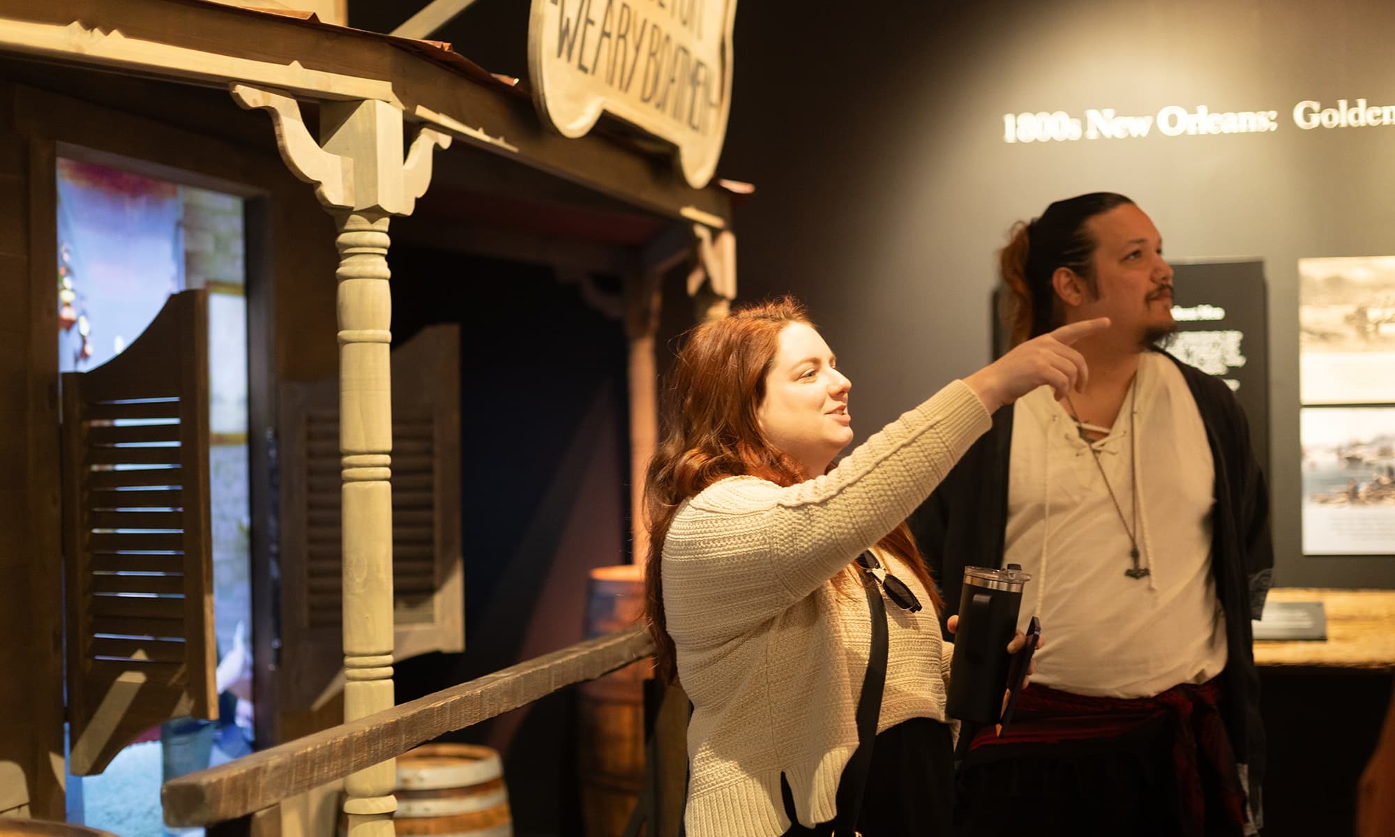 Visitors exploring Storyville museum exhibit in New Orleans