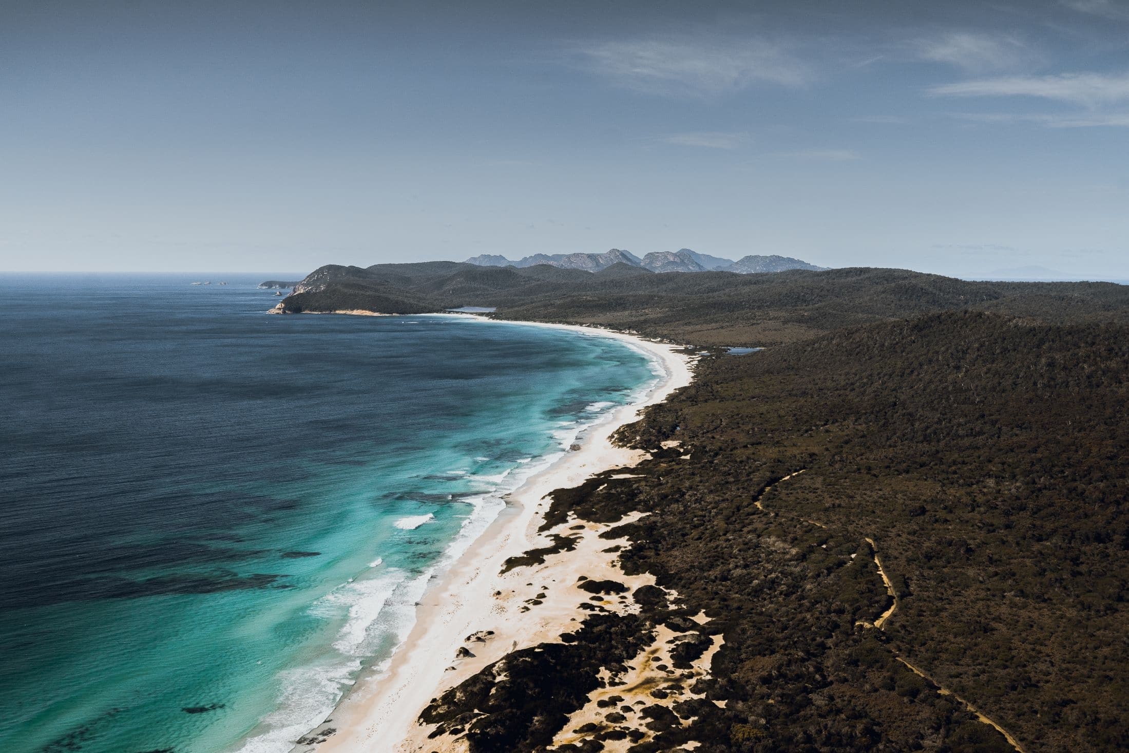 Coastal panorama showing long sandy beach at Freycinet, Tasmania