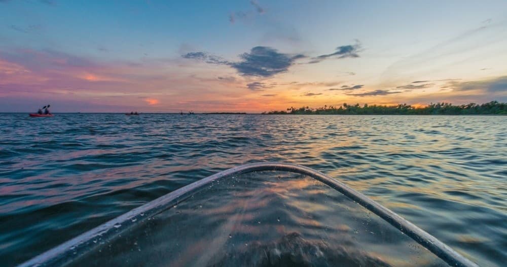 Kayak bow at sunset on open Indian River Lagoon, Titusville
