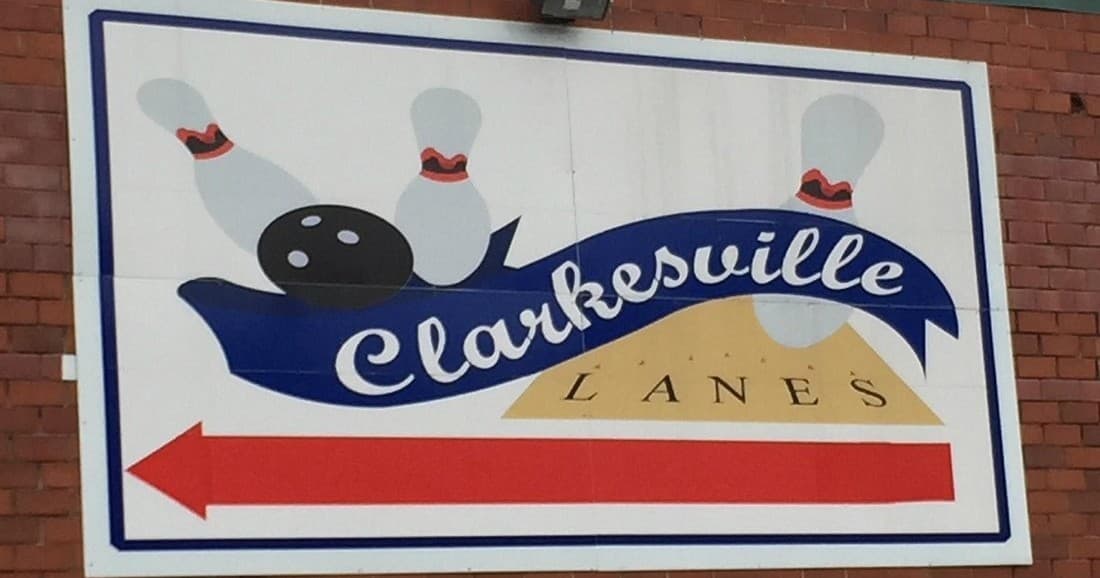 Clarkesville Lanes sign with bowling pins and arrow