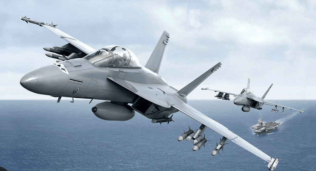 Multiple fighter jets flying over sea in naval exercise