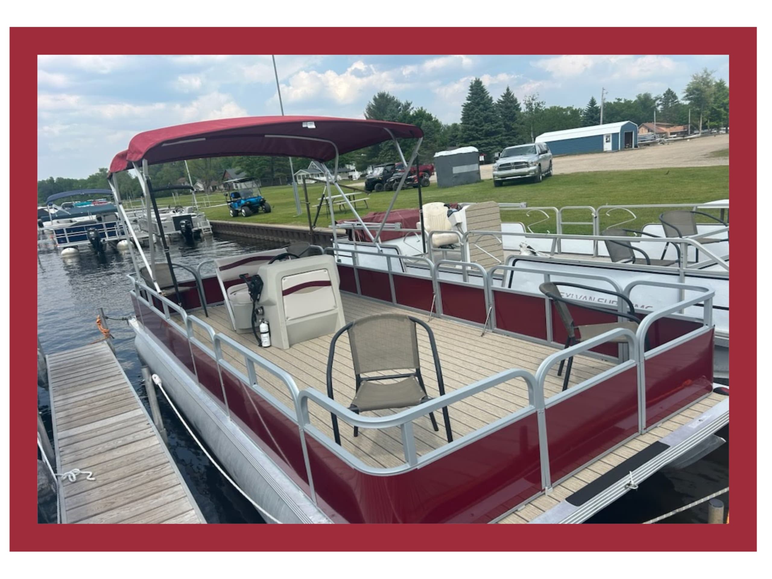 Red pontoon boat docked at St. Helen Marina, scenic lake cruising