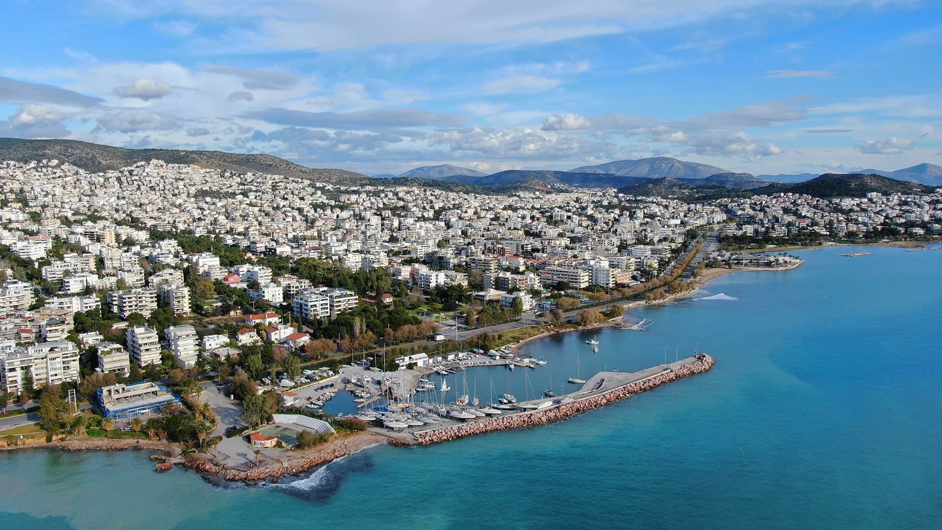Aerial view of coastal city marina and shoreline for waterfront walks