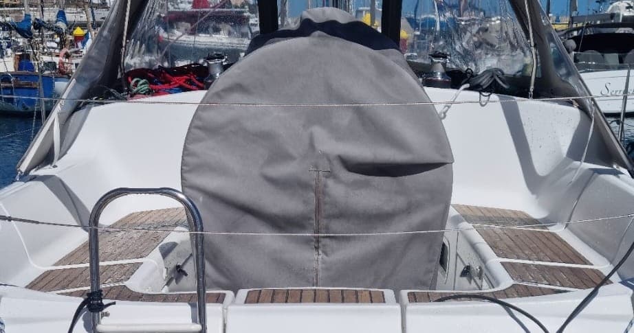 Boat stern and covered helm on yacht, Tenerife marina view