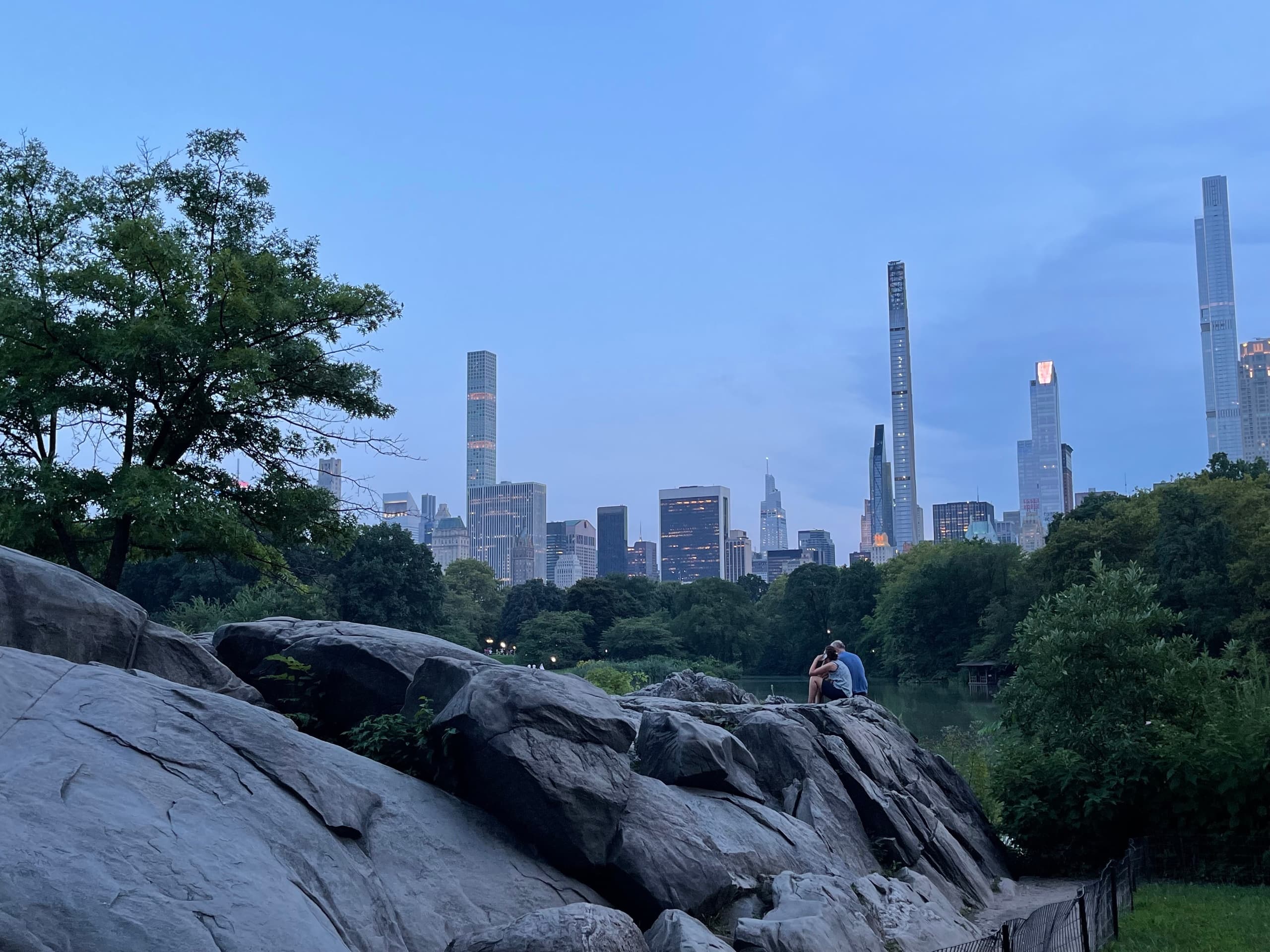 City skyline over Central Park rocks at dusk, scenic overlook