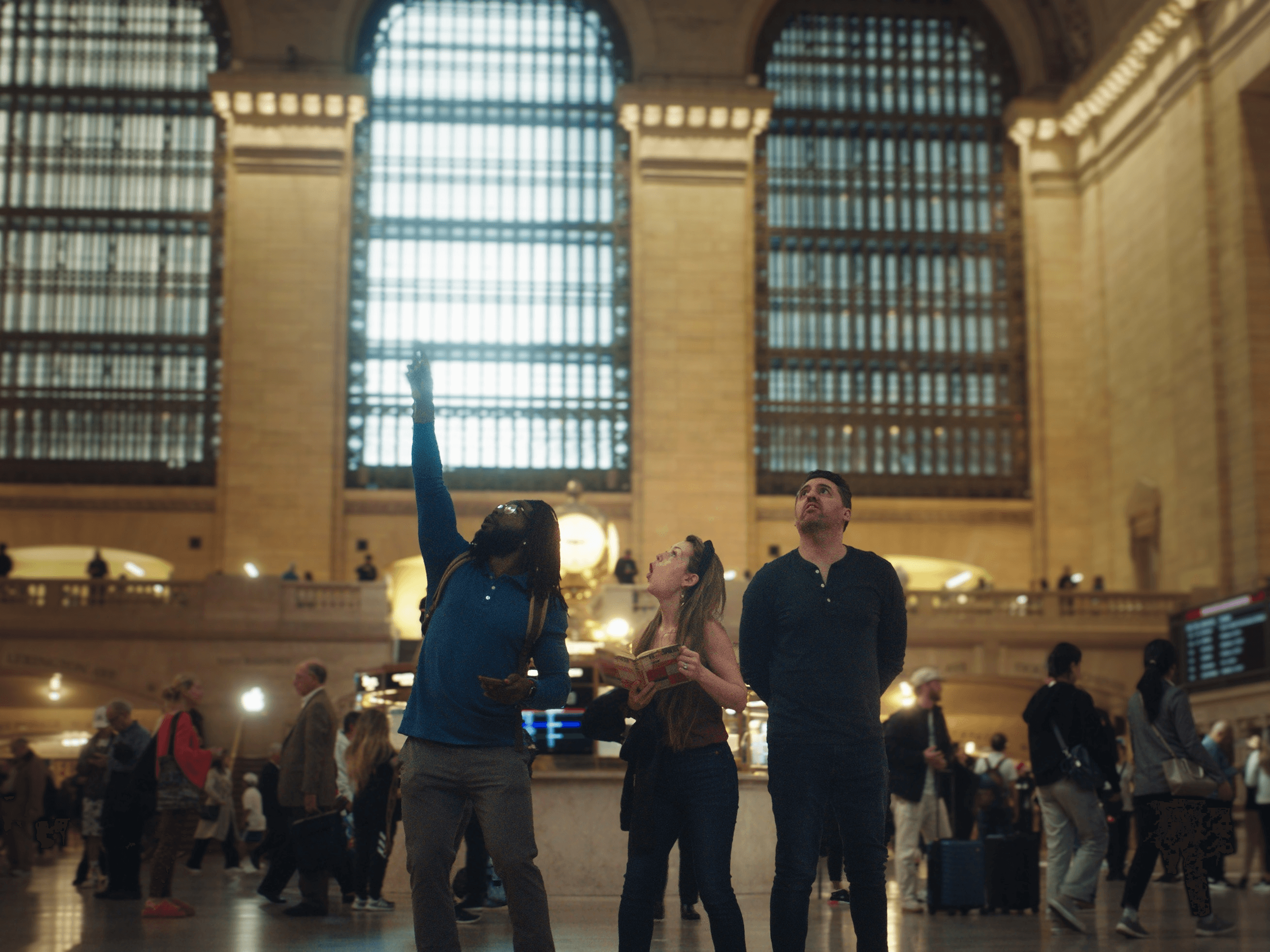 Travelers inside Grand Central Terminal looking up