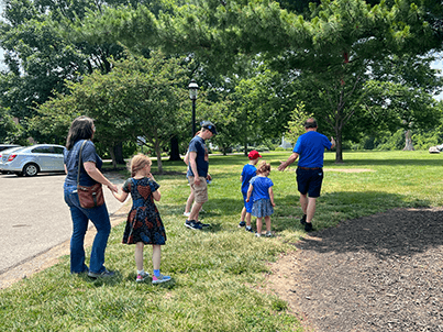Families strolling on Cincinnati Observatory grounds during daytime event