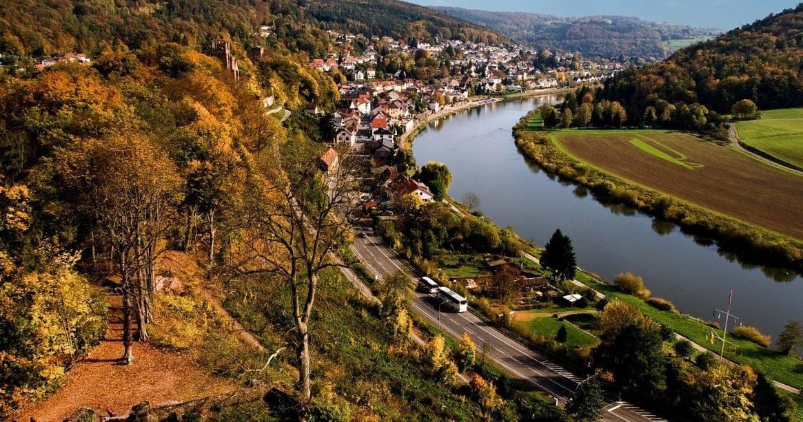 Scenic Neckar River meander through autumn forested valley