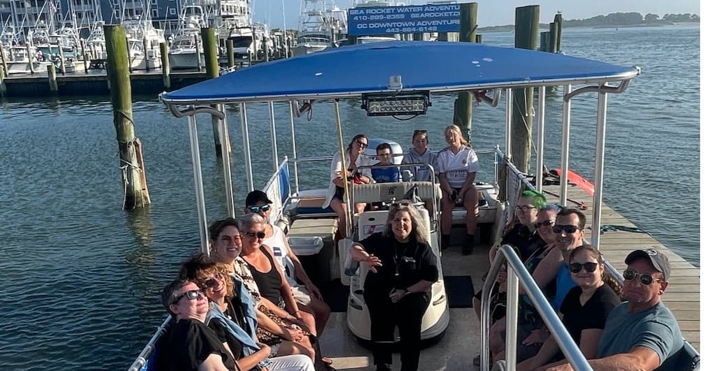 Passengers enjoying guided ghost boat tour on Chesapeake Bay waters