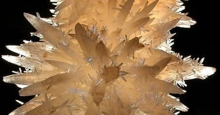 Giant cave calcite crystal cluster display in underground cavern