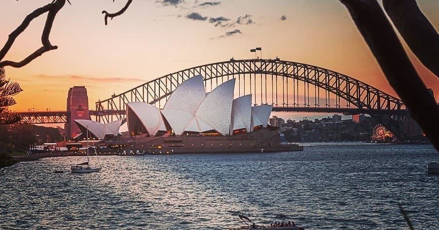 Sydney Harbour view with Opera House and Bridge at sunset