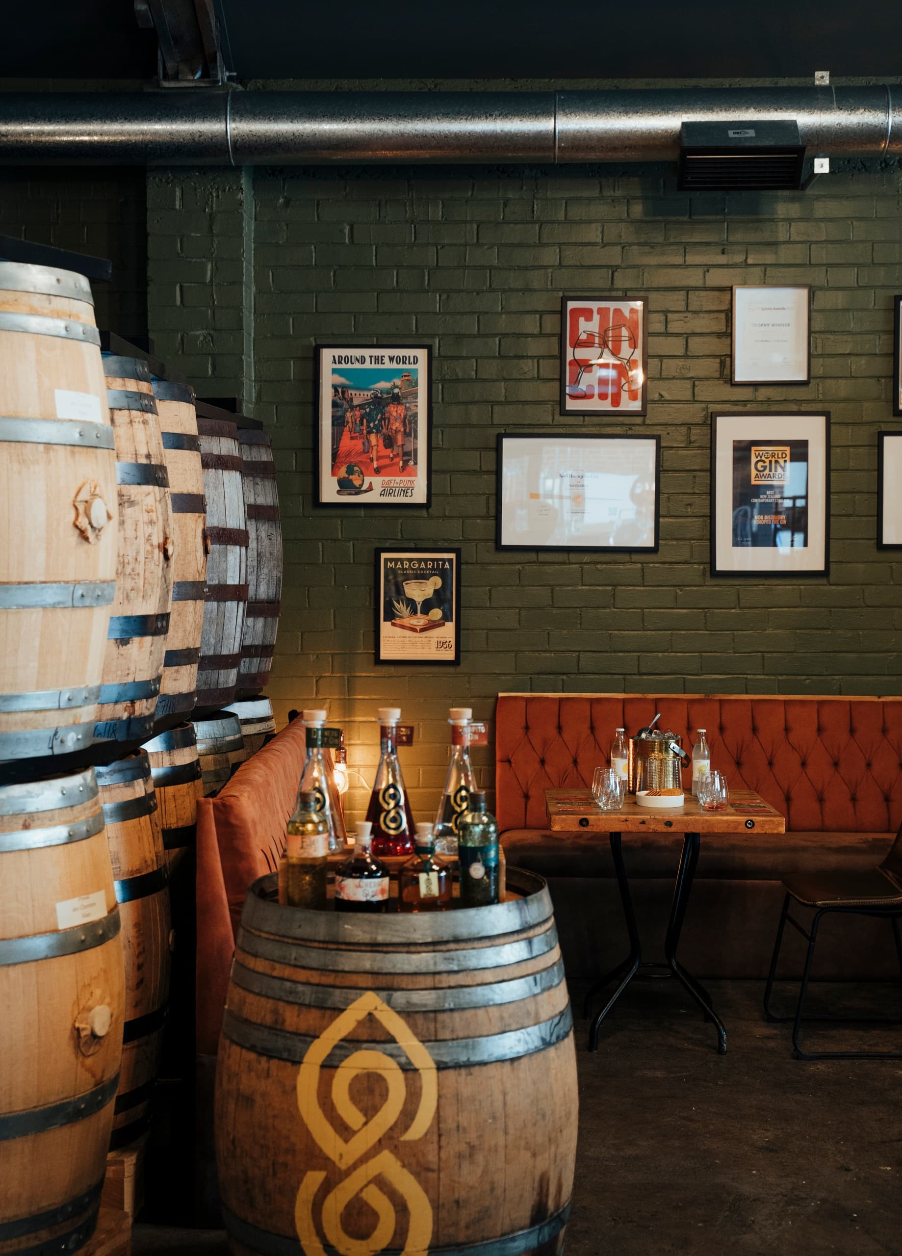 Distillery barrels and bottles in rustic tasting room interior