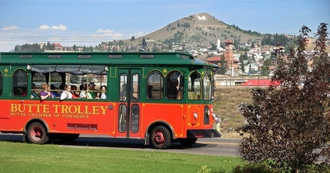 Historic Butte trolley touring scenic hillside and town views