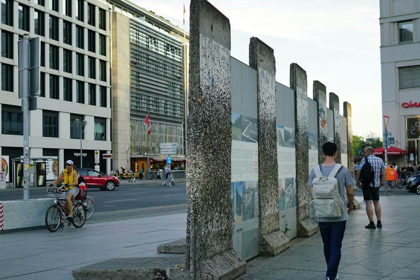 Segments of Berlin Wall on display along busy city street