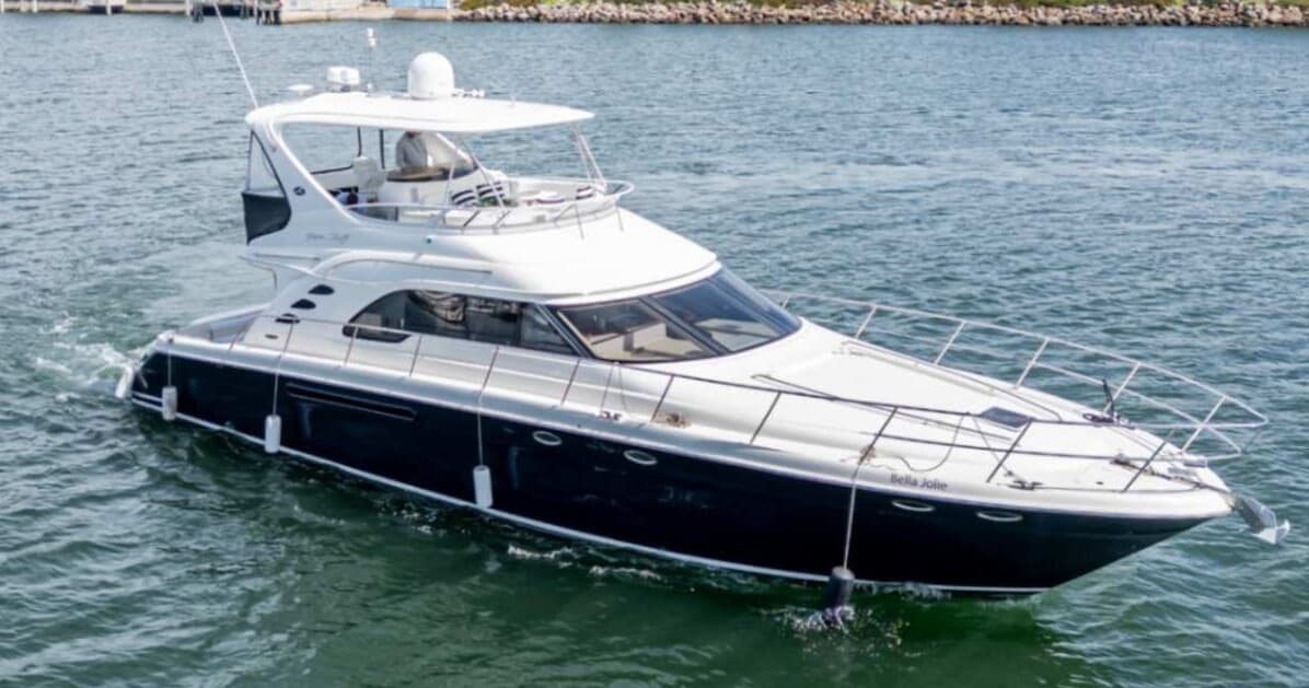 Luxury motor yacht cruising calm turquoise sea under clear sky