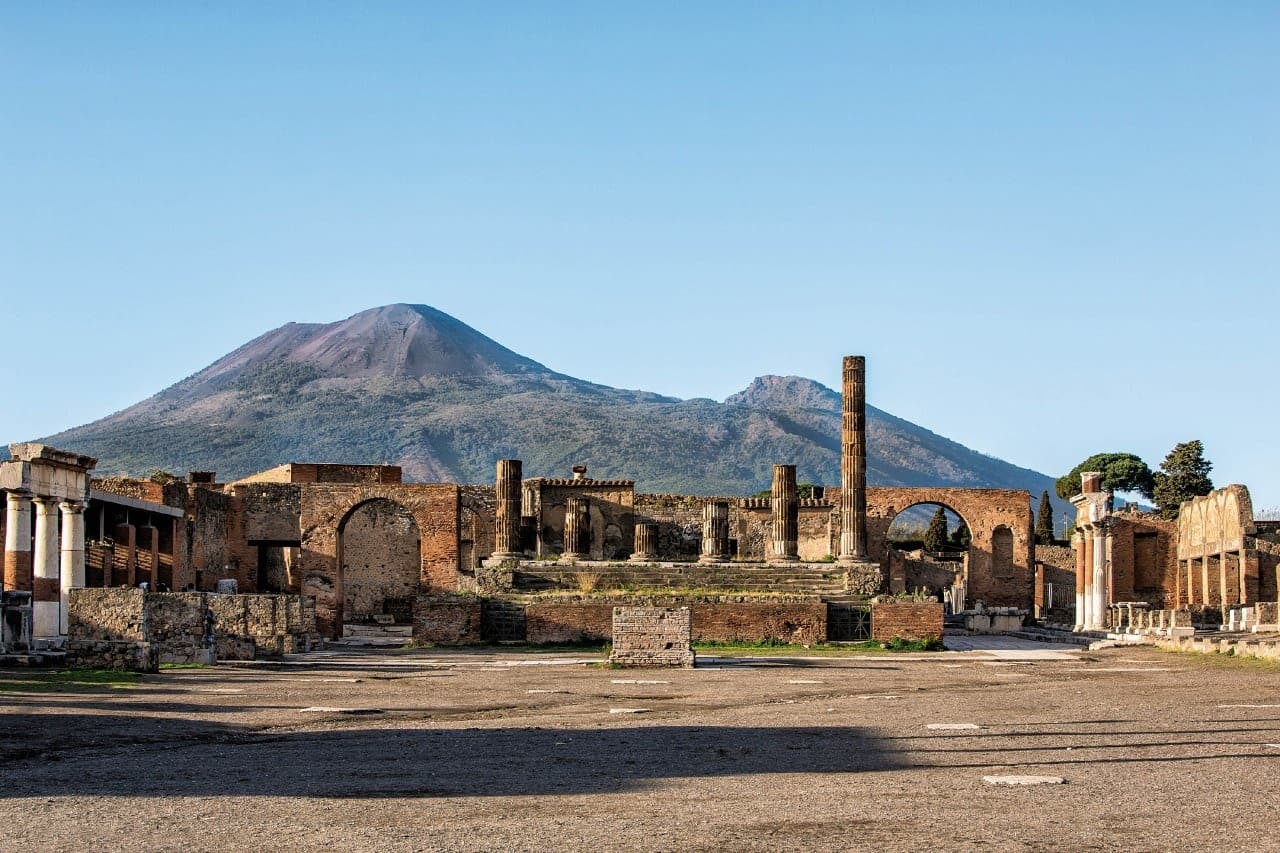 Pompeii archaeological ruins with Vesuvius backdrop, historic hike