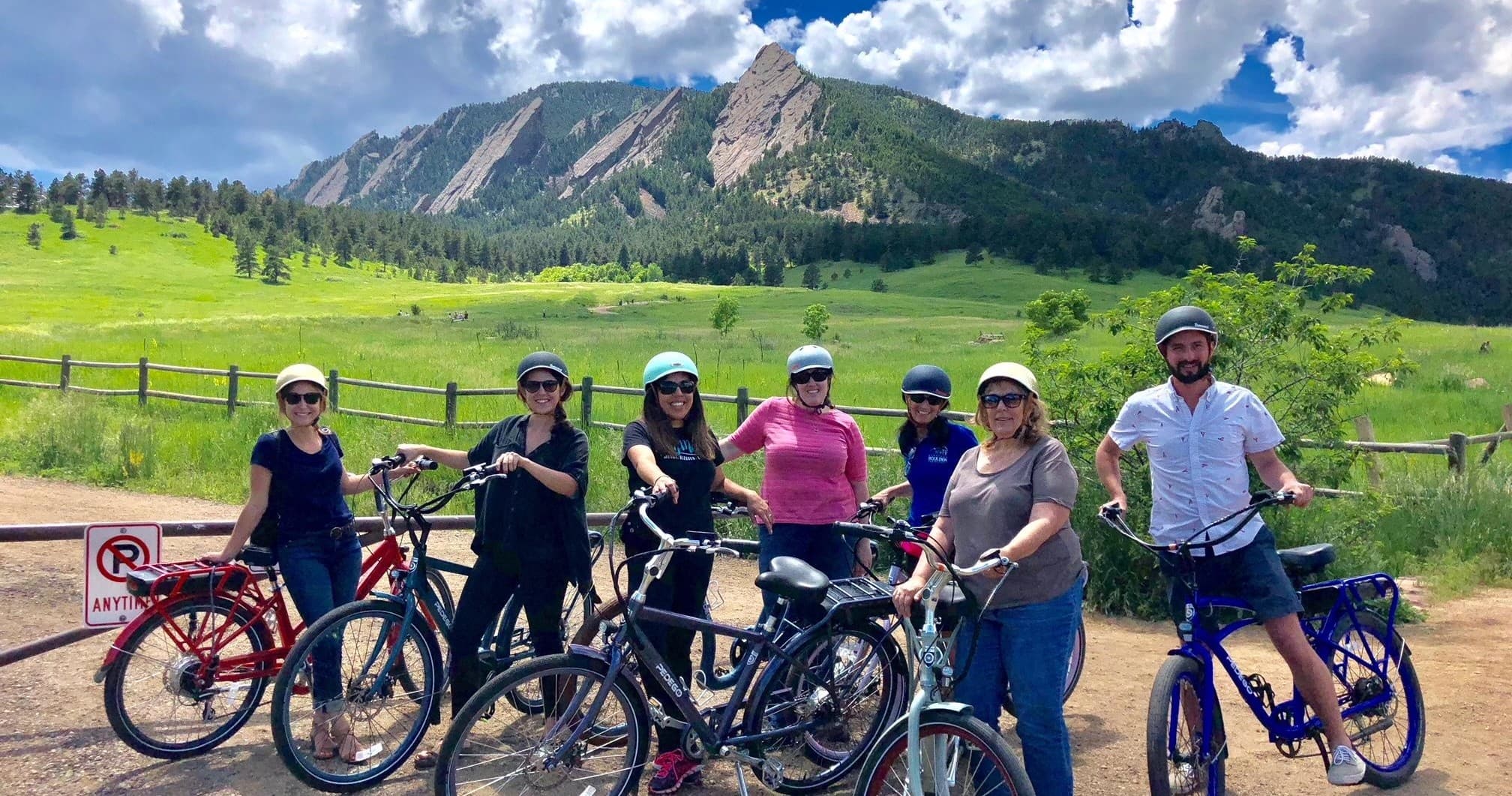 Group e-bike tour in Boulder Flatirons, cycling across meadows