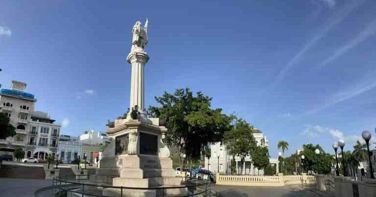 Monument in sunny urban plaza showcasing historic city square