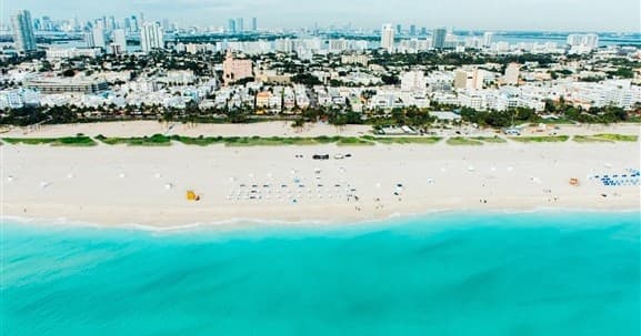 Panoramic beach and city skyline along Miami's sandy shore
