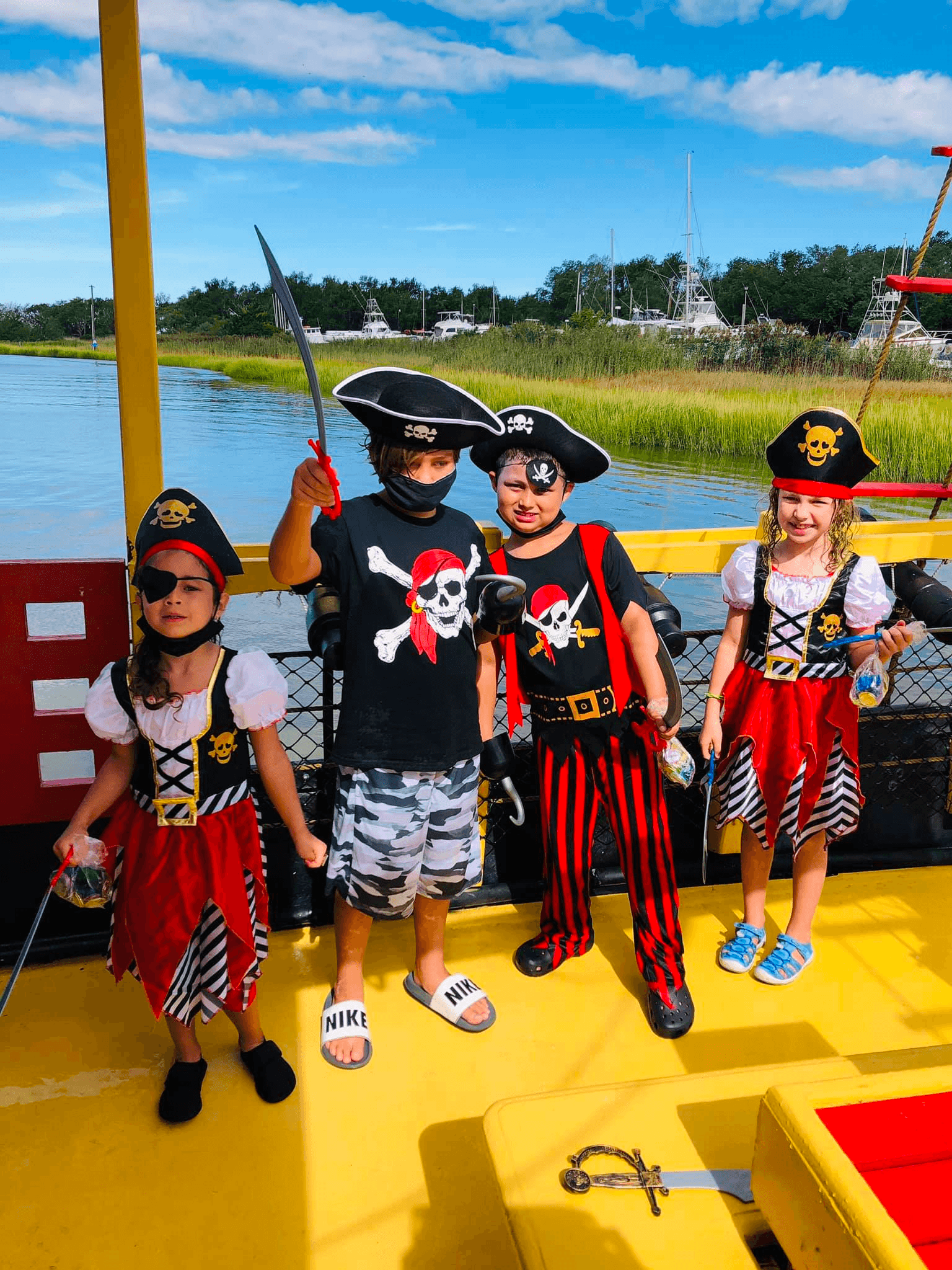 Kids dressed as pirates on ship deck during Lewes family cruise