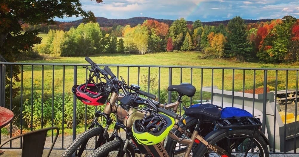 E-bikes on deck overlooking colorful fall foliage in Vermont
