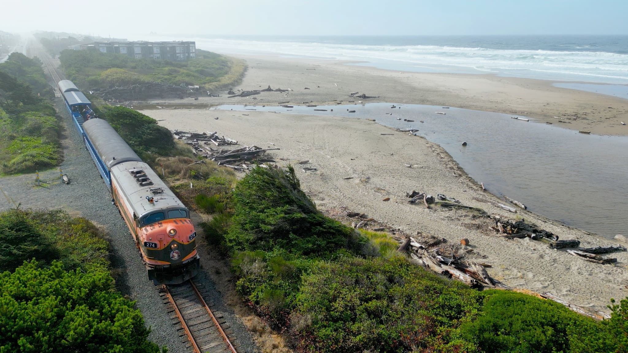 Coastal train ride along sandy beach and ocean views, Oregon
