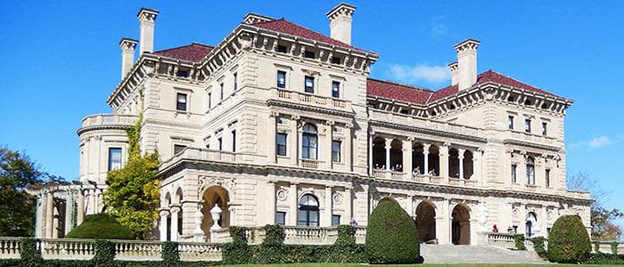 Exterior of Gilded Age Newport mansion with manicured grounds