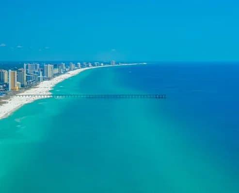 Helicopter tour over Panama City Beach coastline and pier