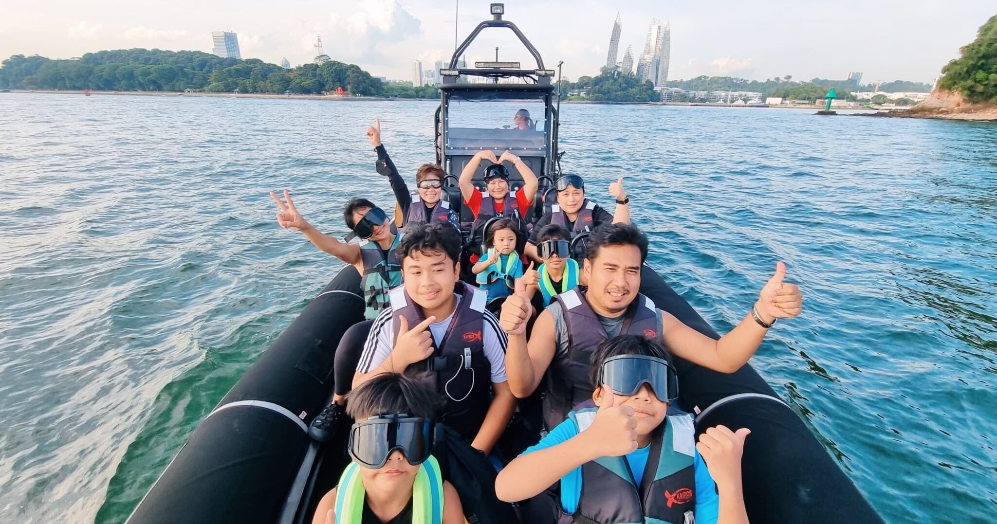RIB boat tour with smiling group offshore near island coast