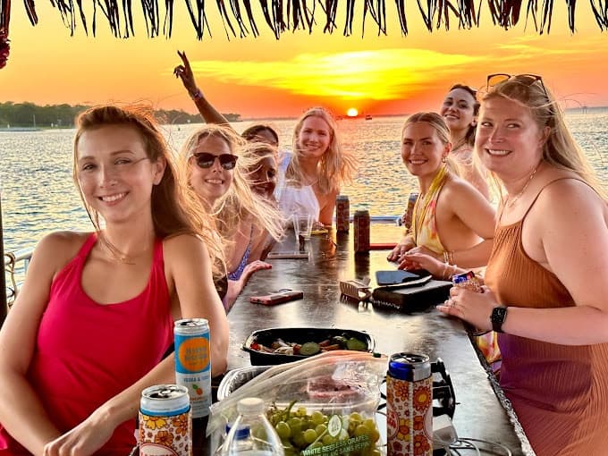 Golden sunrise over the Gulf horizon during Destin boat tour