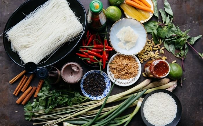 Raw ingredients and spices arranged for Dutch cooking class prep