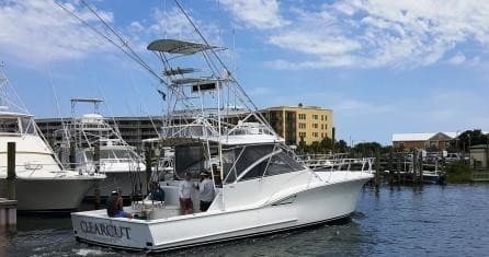 Sportfishing boat docked at marina, offshore fishing charter