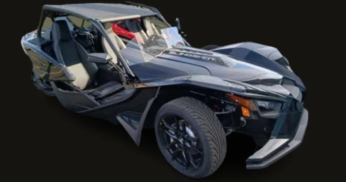 Three-wheel roadster angled studio shot showcasing open-cockpit ride