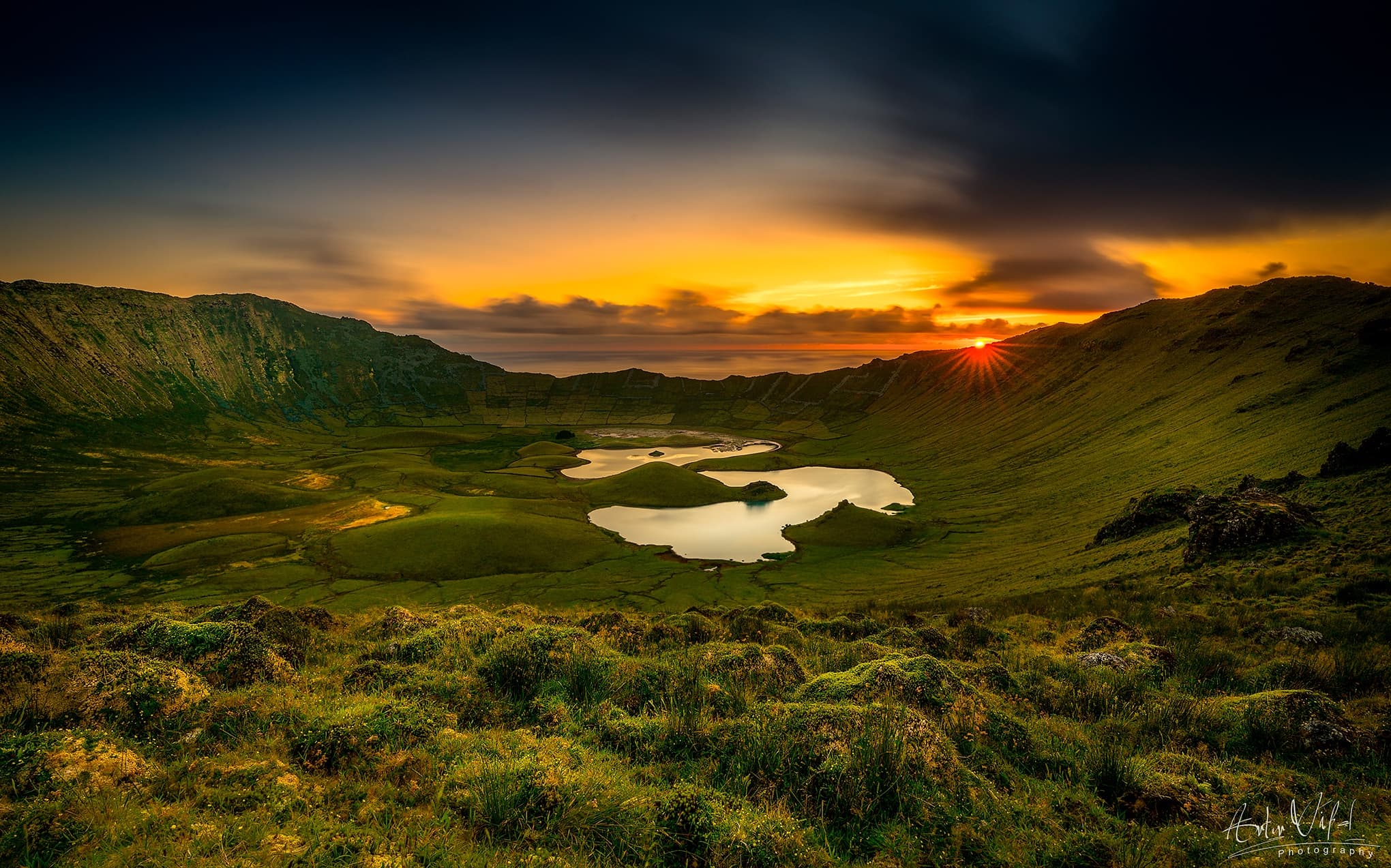 Sunset over verdant crater lakes and rolling green highlands