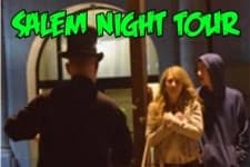 Salem night walking tour guide escorting visitors into historic doorway