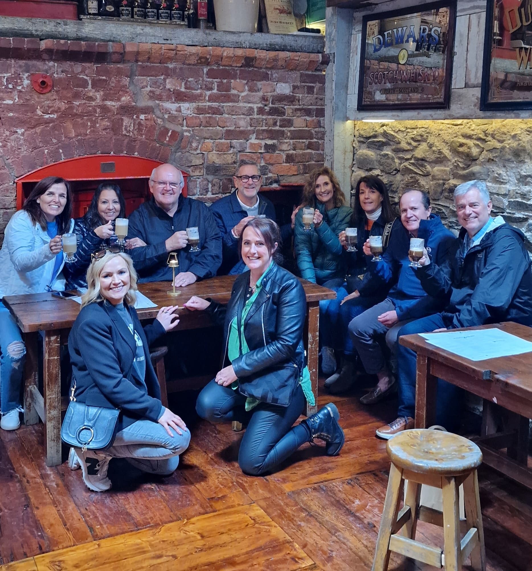People enjoying food and drinks on Kenmare food tour inside cozy pub