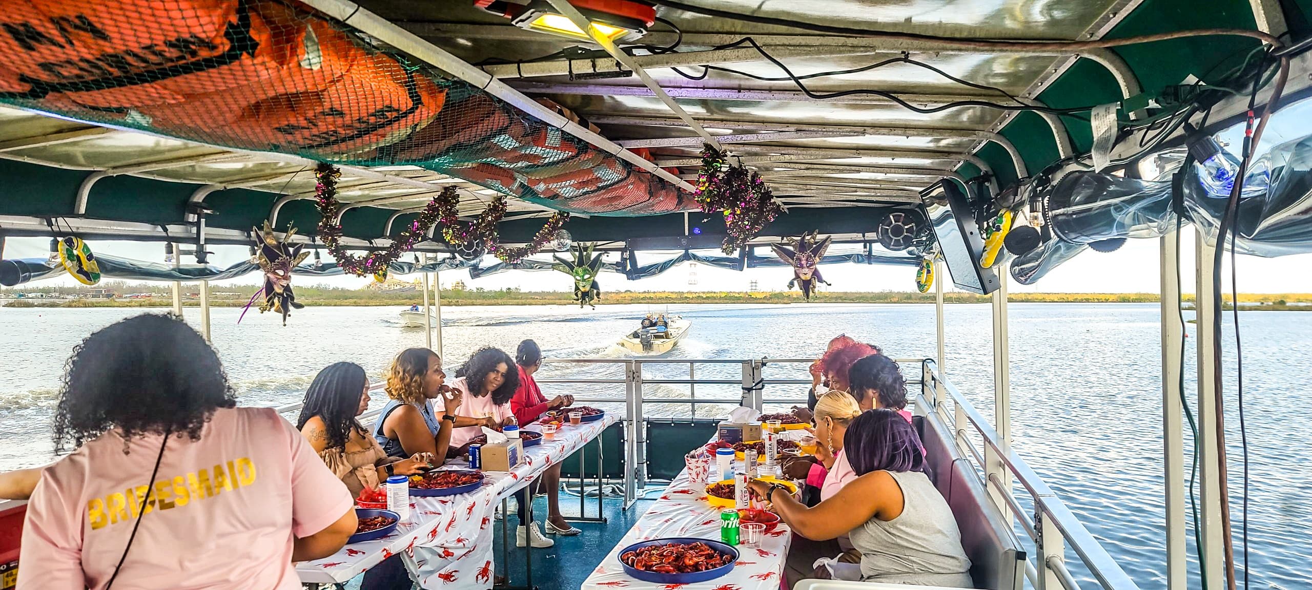 Group enjoying catered sunset boat cruise with coastal views