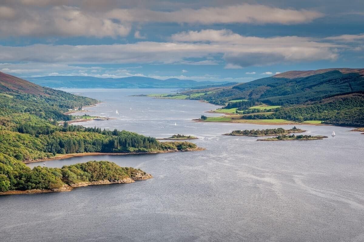 Panoramic sea loch and islands view over rugged coastline