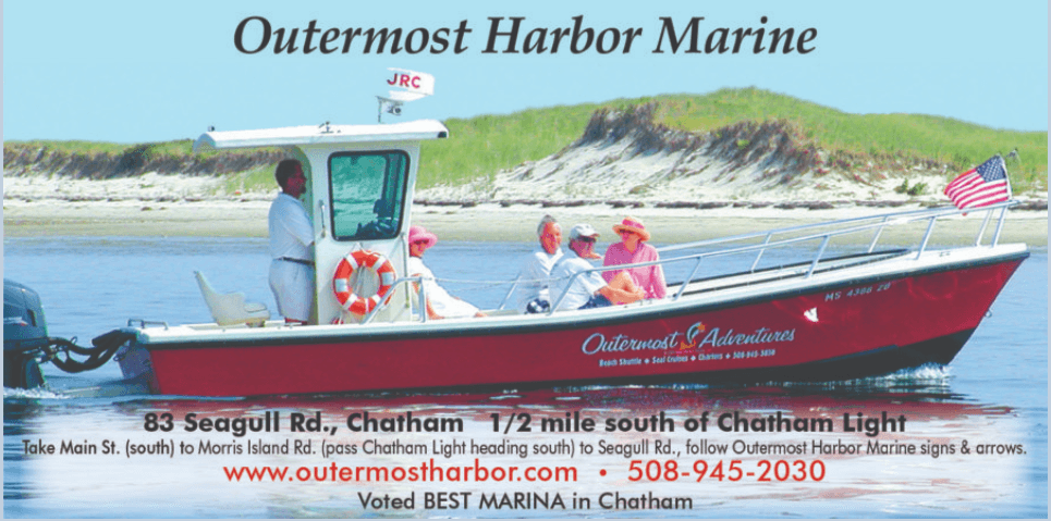Outermost Harbor Marine promotional boat poster at Chatham shoreline