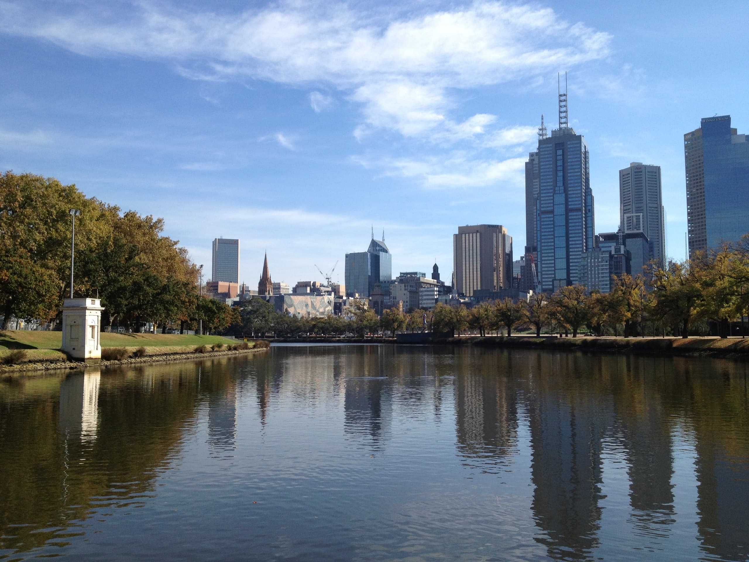 Panoramic Melbourne skyline across Yarra River on clear day