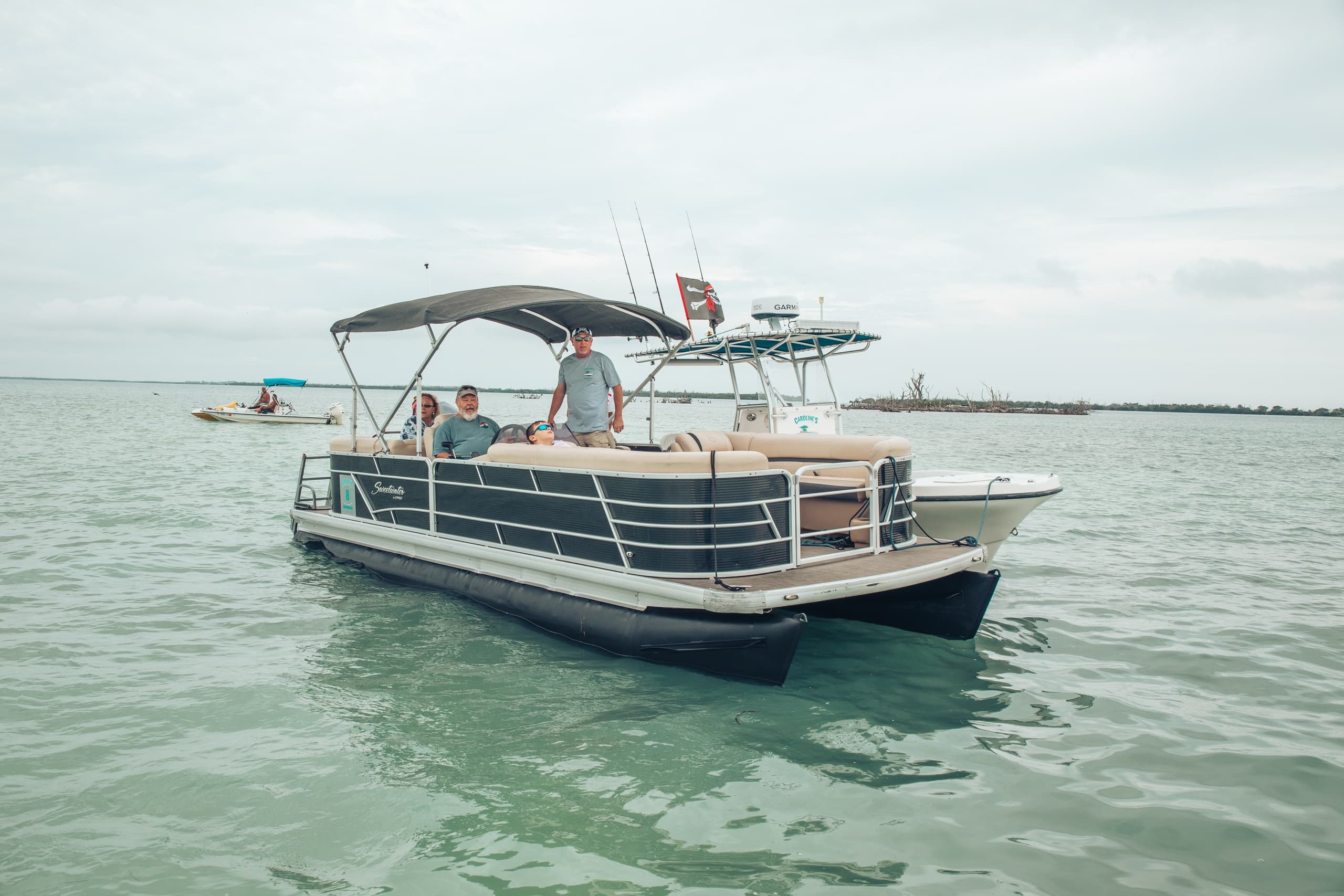 Leisure pontoon boat cruising calm Florida Keys coastal waters