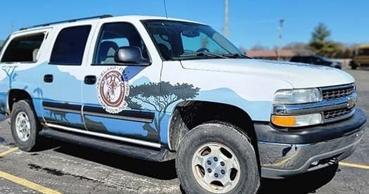 Animals Safari branded SUV parked in outdoor safari lot