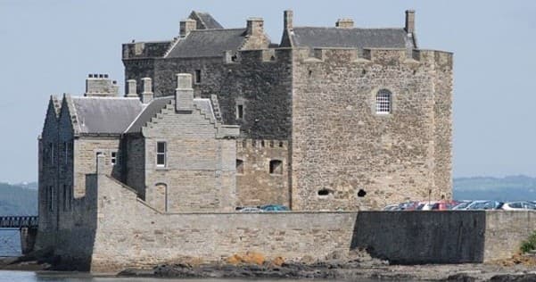Coastal medieval castle on rocky shore, seaside heritage tour