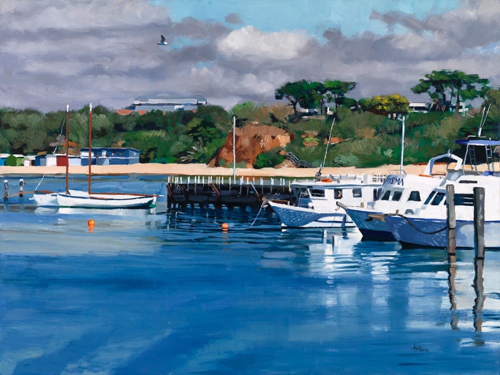 Boats moored in a calm seaside harbor at Mornington Peninsula
