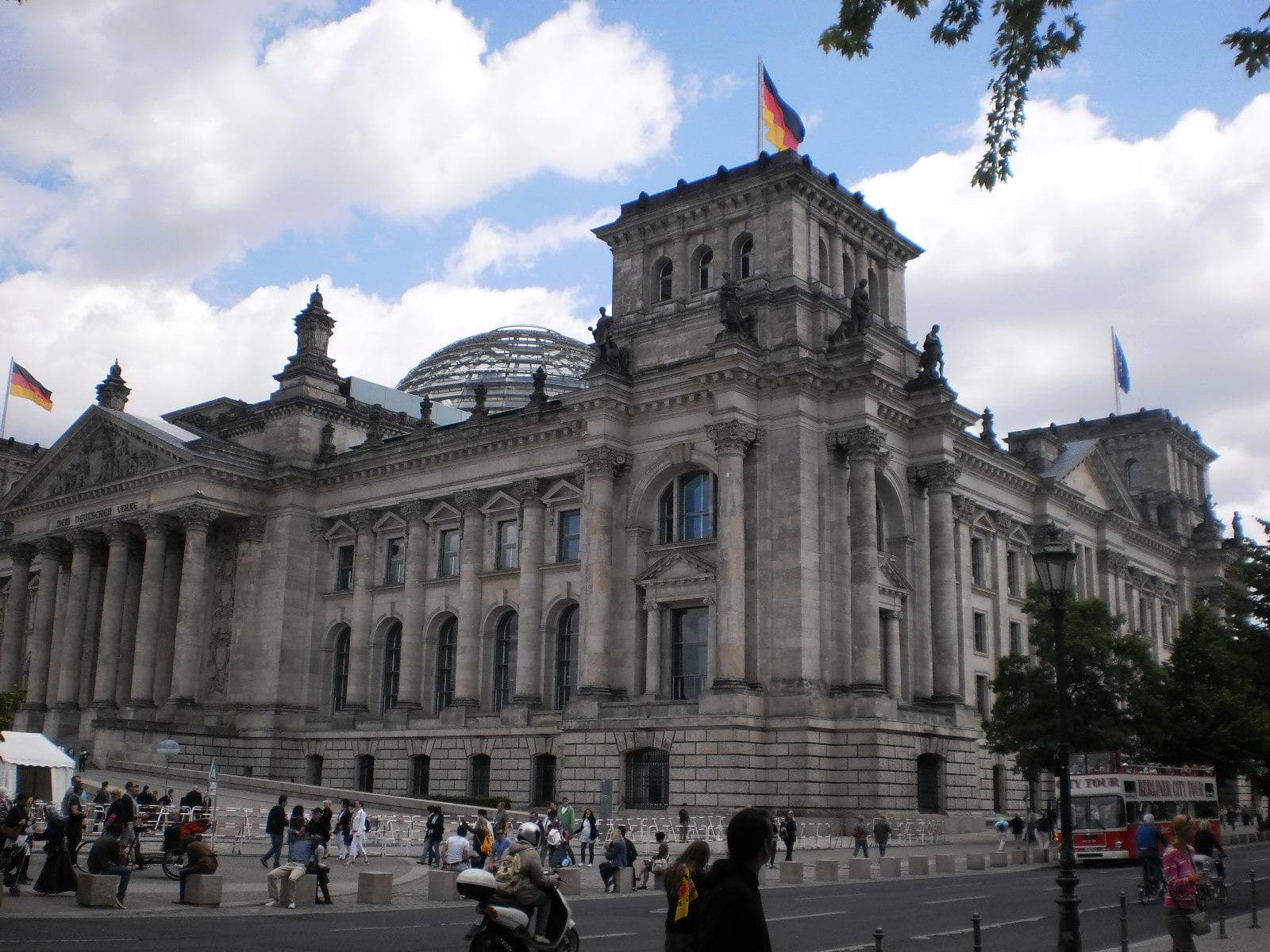 Tourists viewing Reichstag dome and architecture in central Berlin