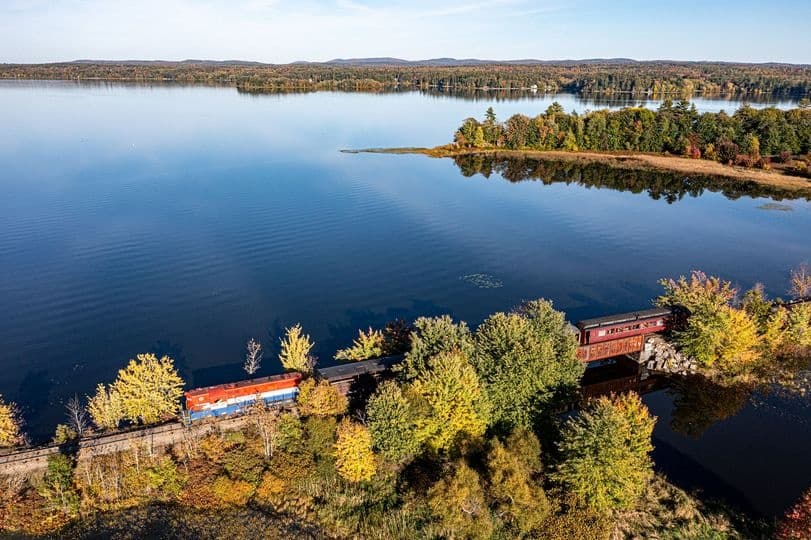 Aerial train ride along Moosehead Lake shoreline in Maine