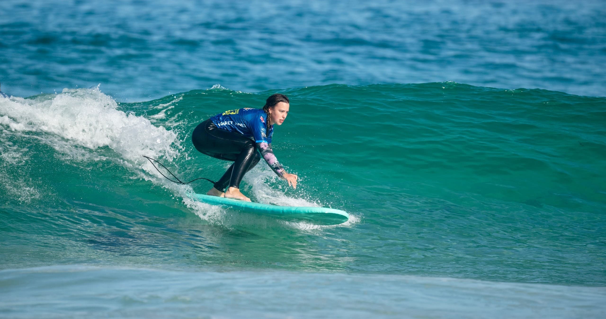 Surfer carving a green wave off Margaret River coast