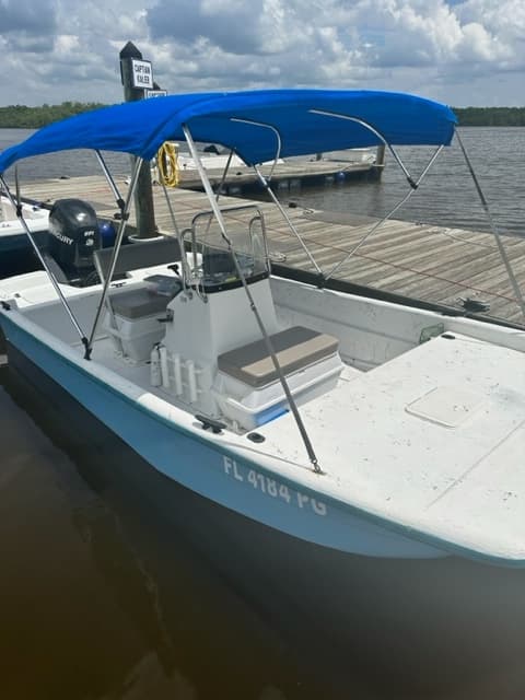 Small skiff with blue bimini on coastal Everglades waters