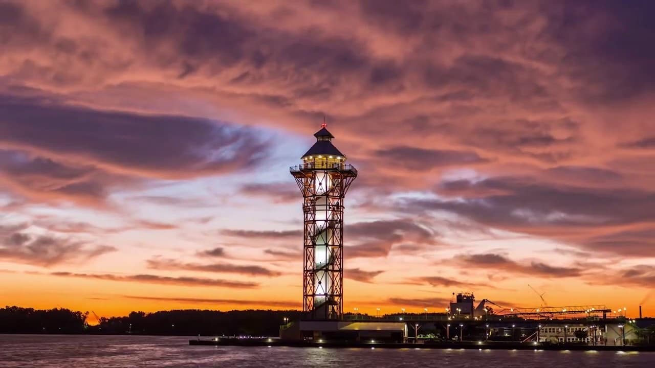 Water taxi near lighthouse at sunset on Lake Erie